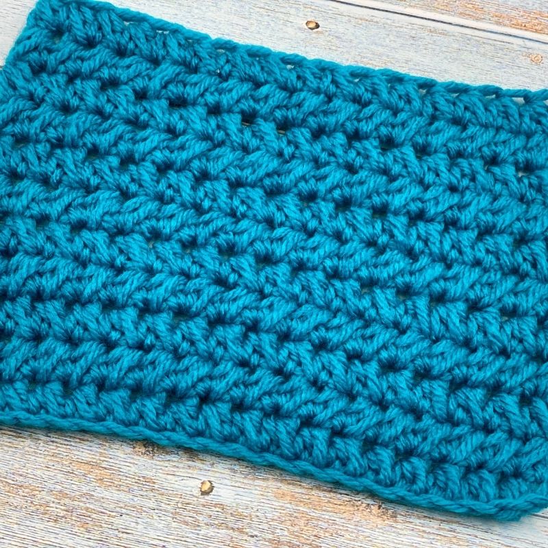 Learn to crochet the Half Double Crochet Cluster Cluster Stitch; photo and video tutorial