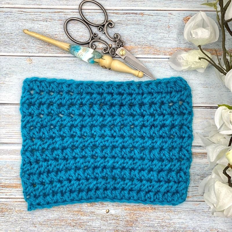 Learn to crochet the Half Double Crochet Cluster Cluster Stitch; photo and video tutorial