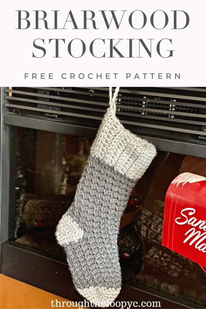 Crochet Christmas Stocking hanging on a fireplace 