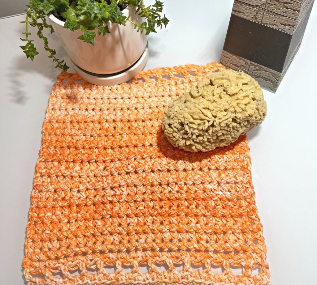 Crochet Washcloth free pattern tester picture in orange ombre